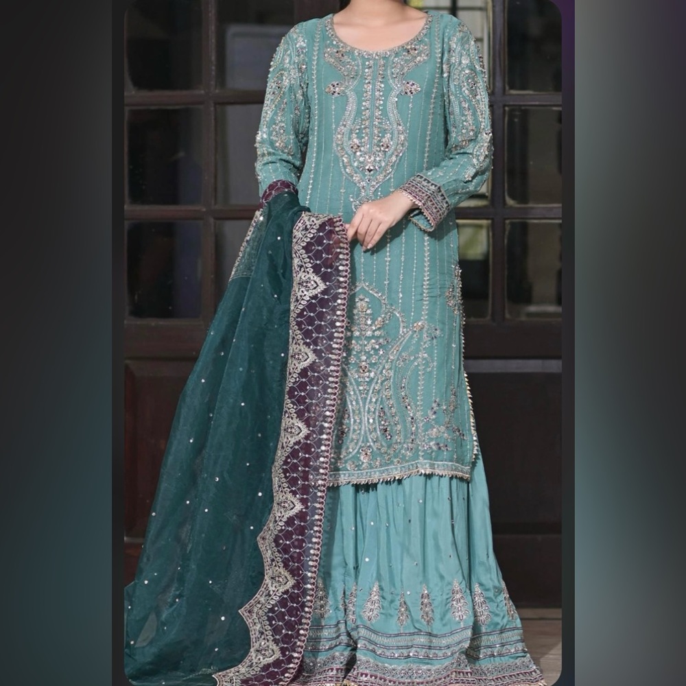 Handwork and embroidery with intricate details.
Shirt/Gharara/Net duppatta